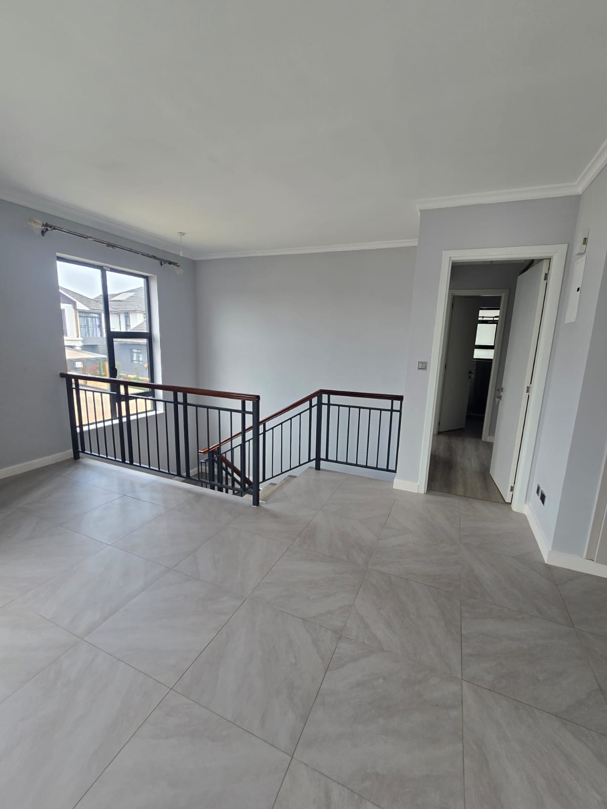 Custom fabricated metal fence combining straight lines and curved elements for elegant perimeter security